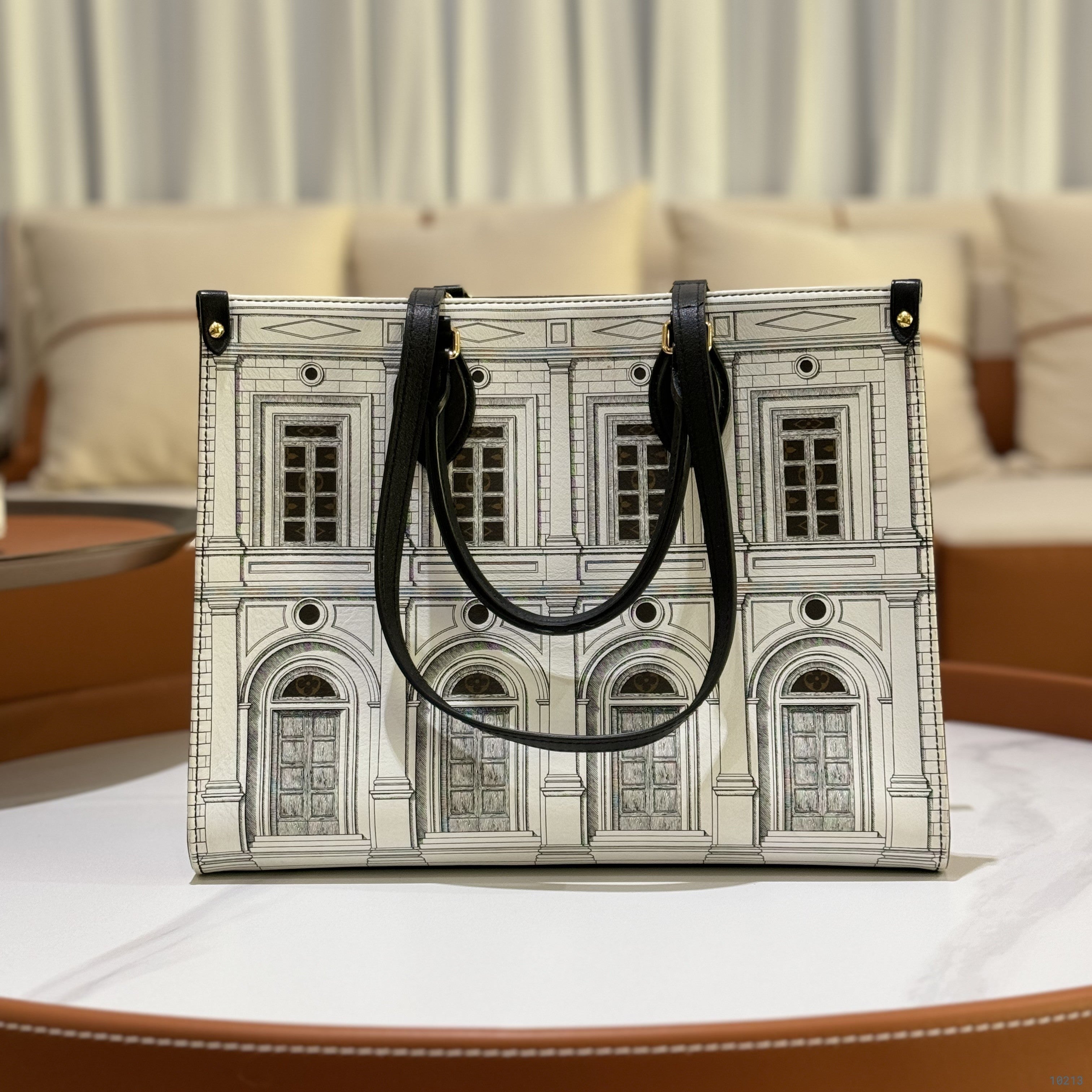 LOUIS VUITTON × FORNASETTI ON THE GO MEDIUM