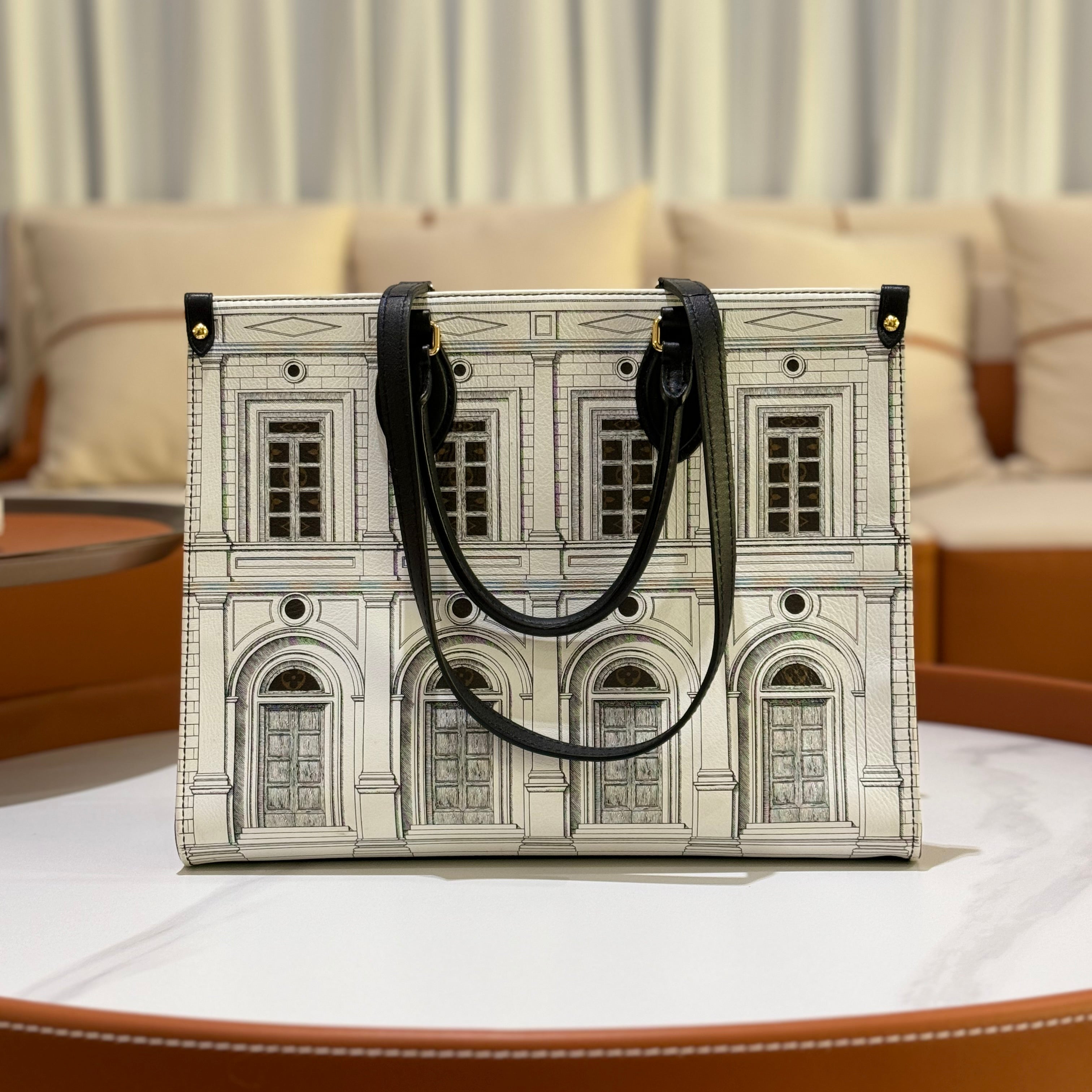 LOUIS VUITTON × FORNASETTI ON THE GO MEDIUM