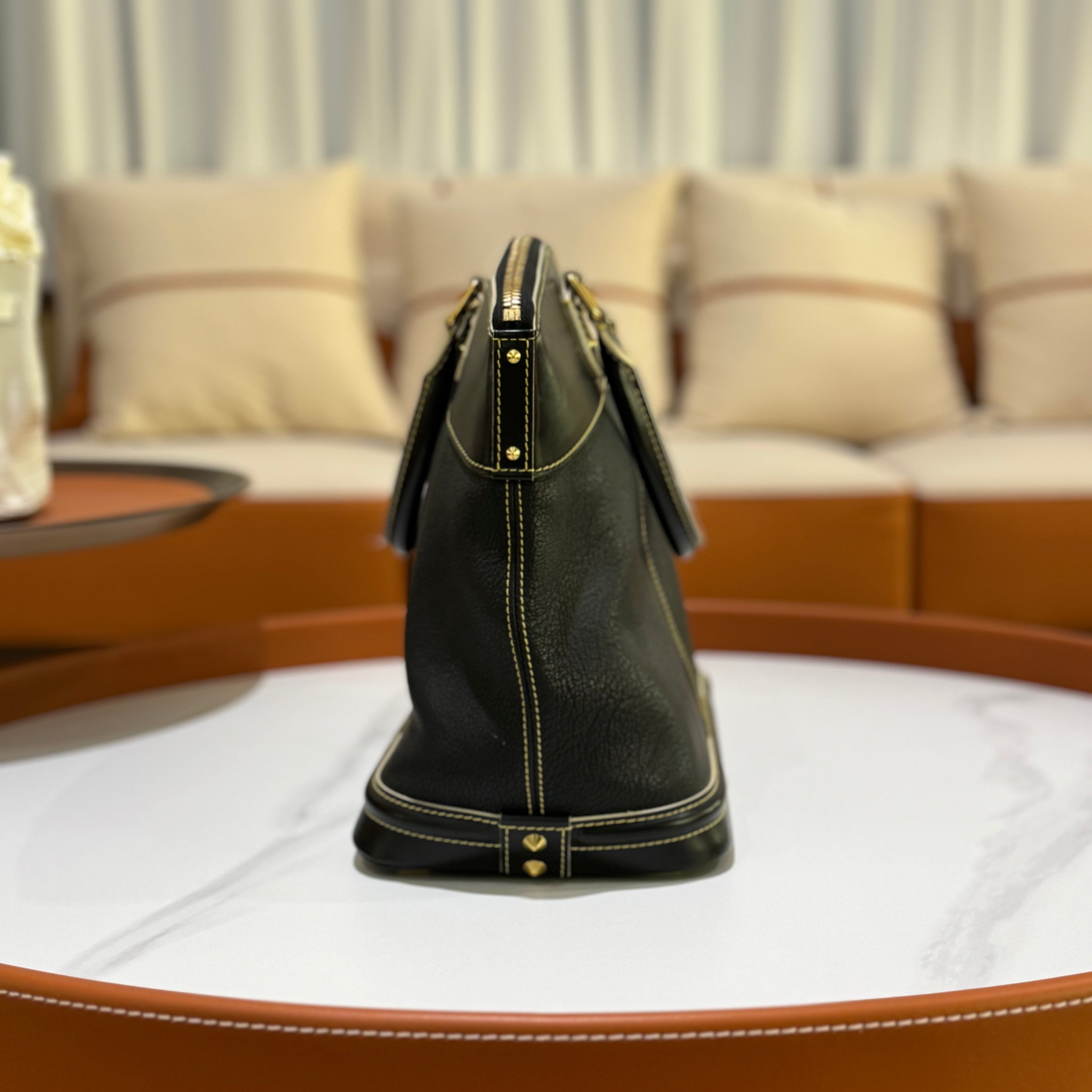 LOUIS VUITTON SUHALI LOCK IT MM