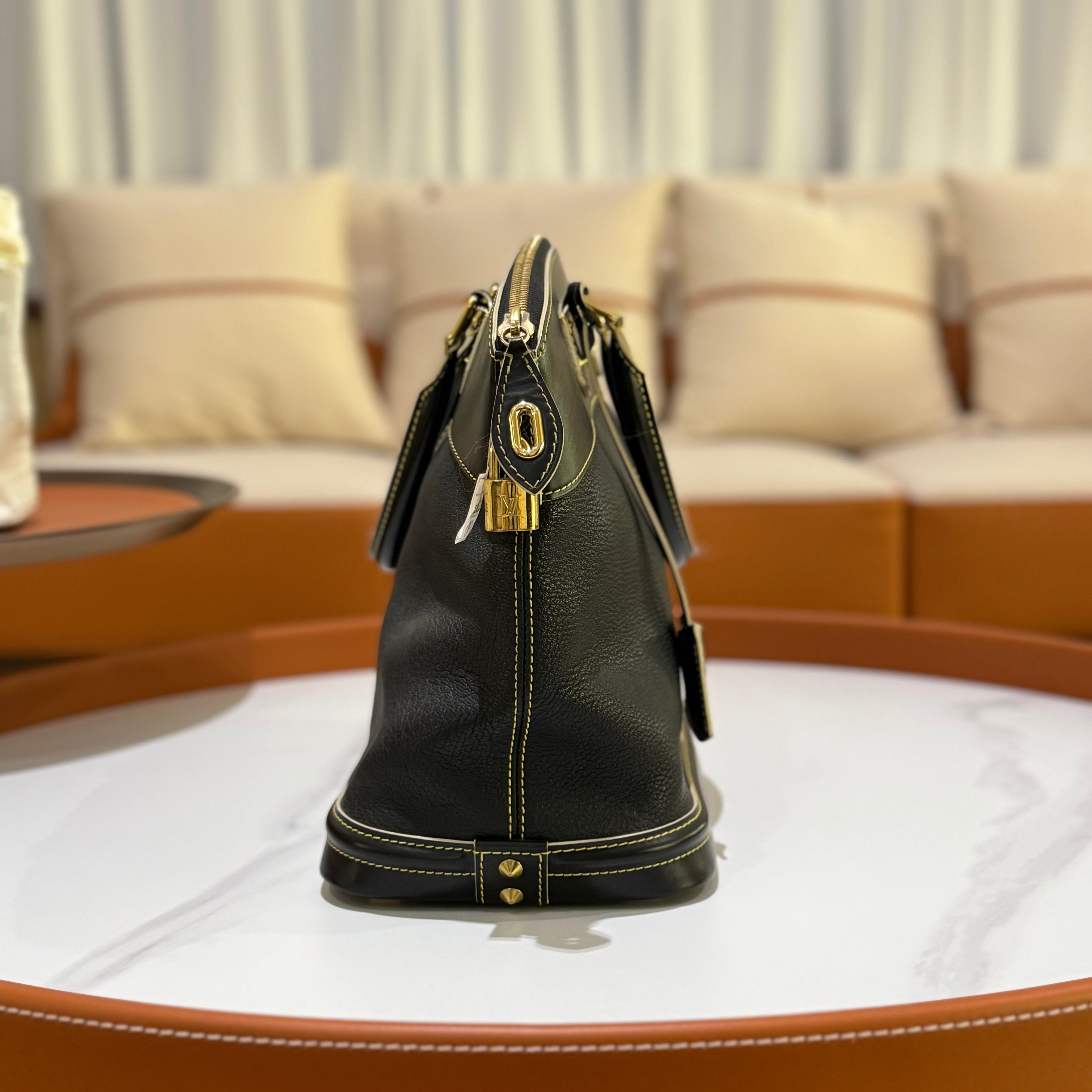 LOUIS VUITTON SUHALI LOCK IT MM