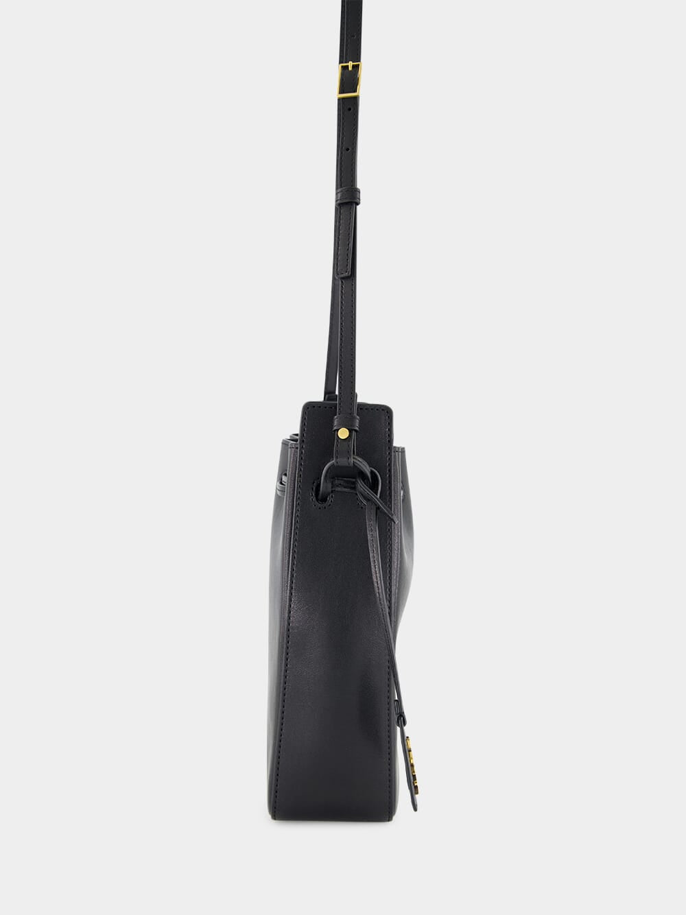 Black Leather Bucket Bag with Cassandre Charm